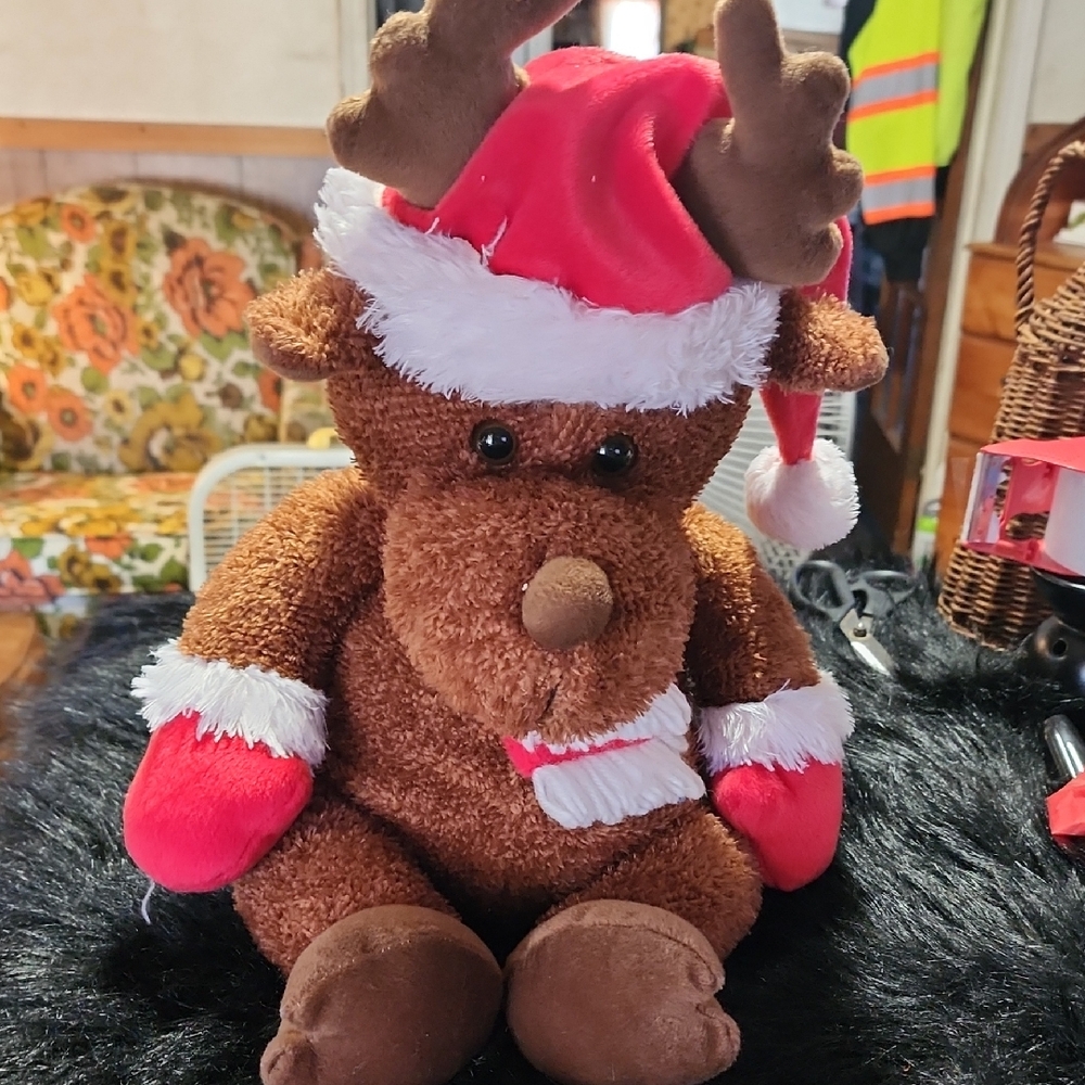 Brown Plush Moose with Red Santa Hat. Merry Christmas Scarf.